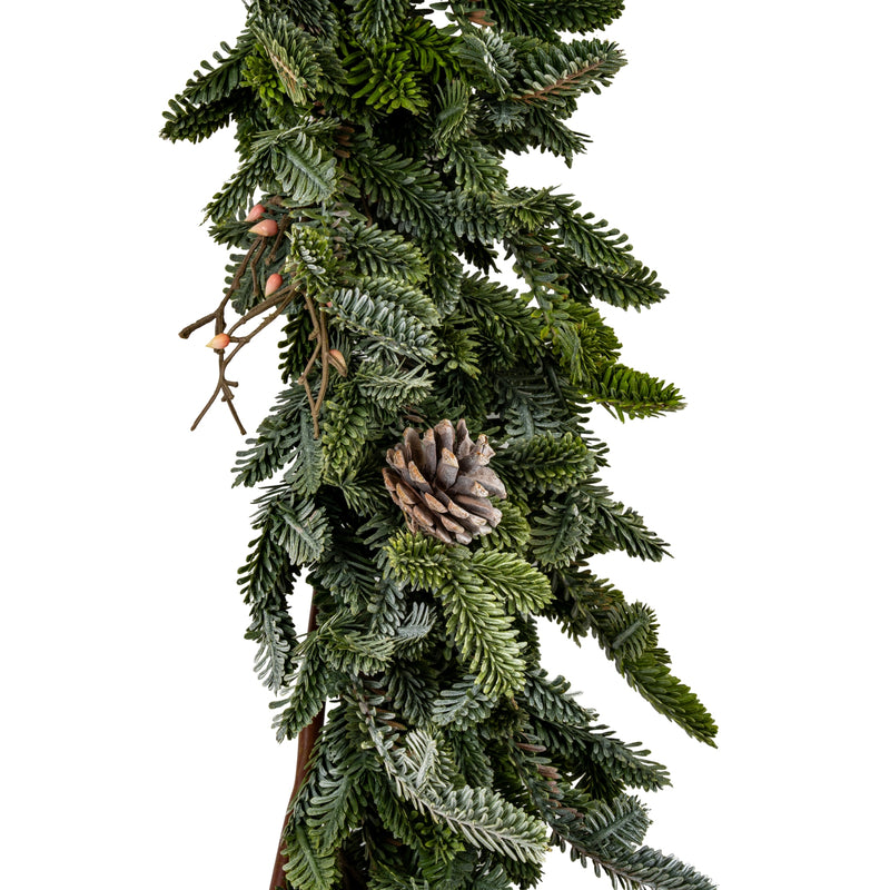 Close-up of pine needles, pinecones and twigs on the garland