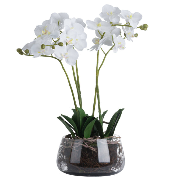 Artificial white orchid in a clear glass pot