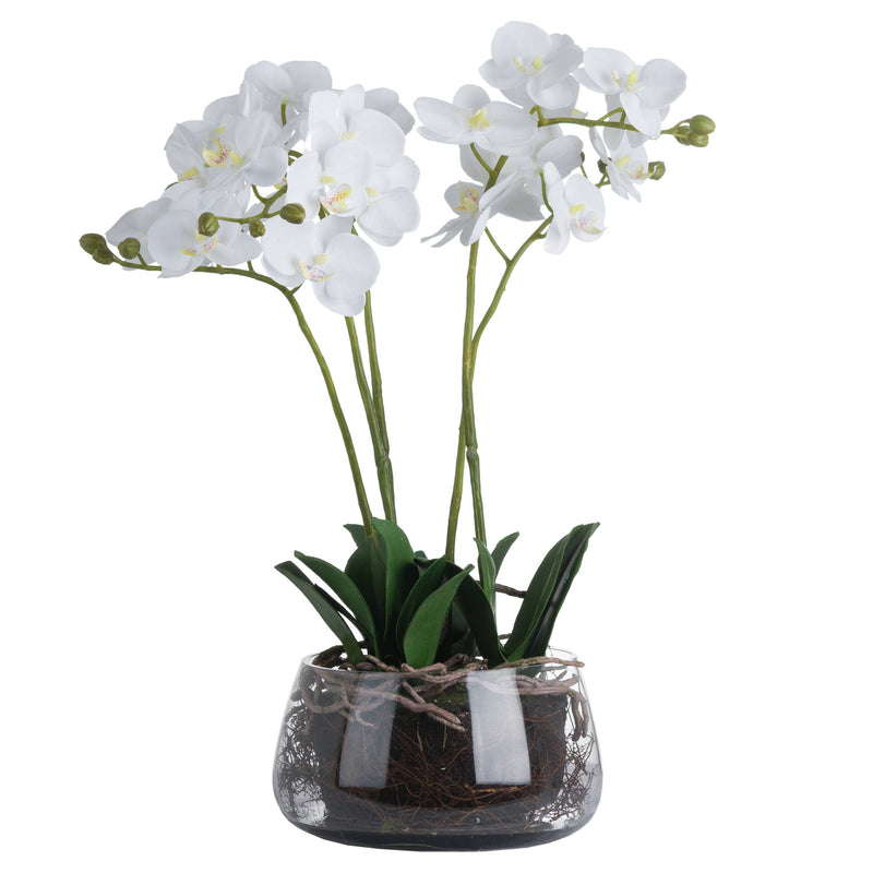 Artificial white orchid in a clear glass pot