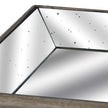 Close-up of the distressed mirrored corner