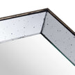 Close-up of the distressed mirror corner and wooden edge