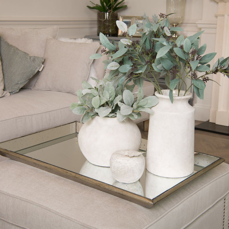 Astor Large Distressed Mirrored Tray with Wood Trim – 80cm, mirrored tray with white vases and greenery on a coffee table