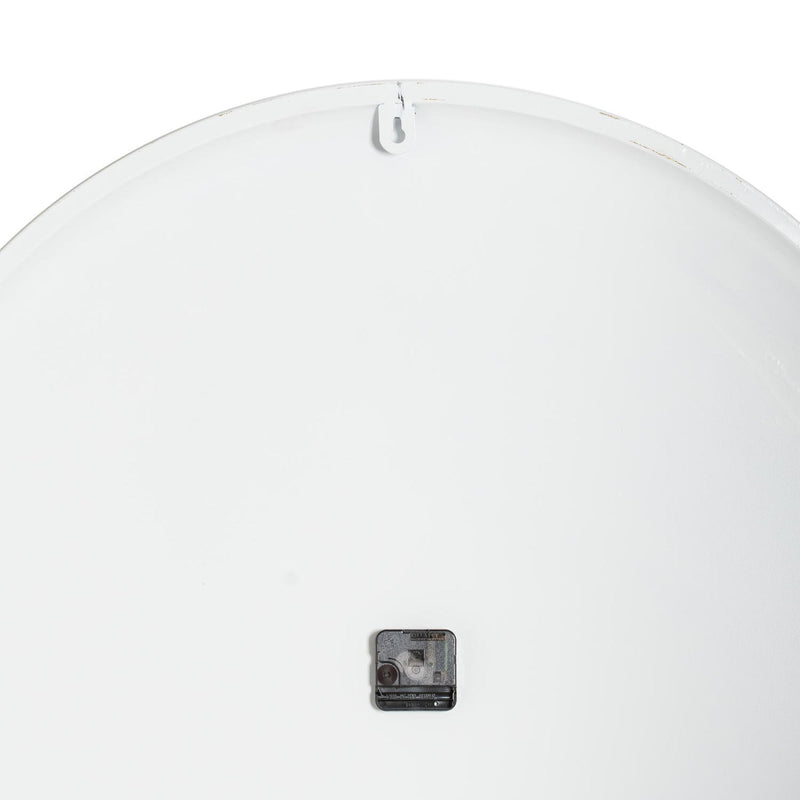 Back of the white clock showing the movement and hanging point