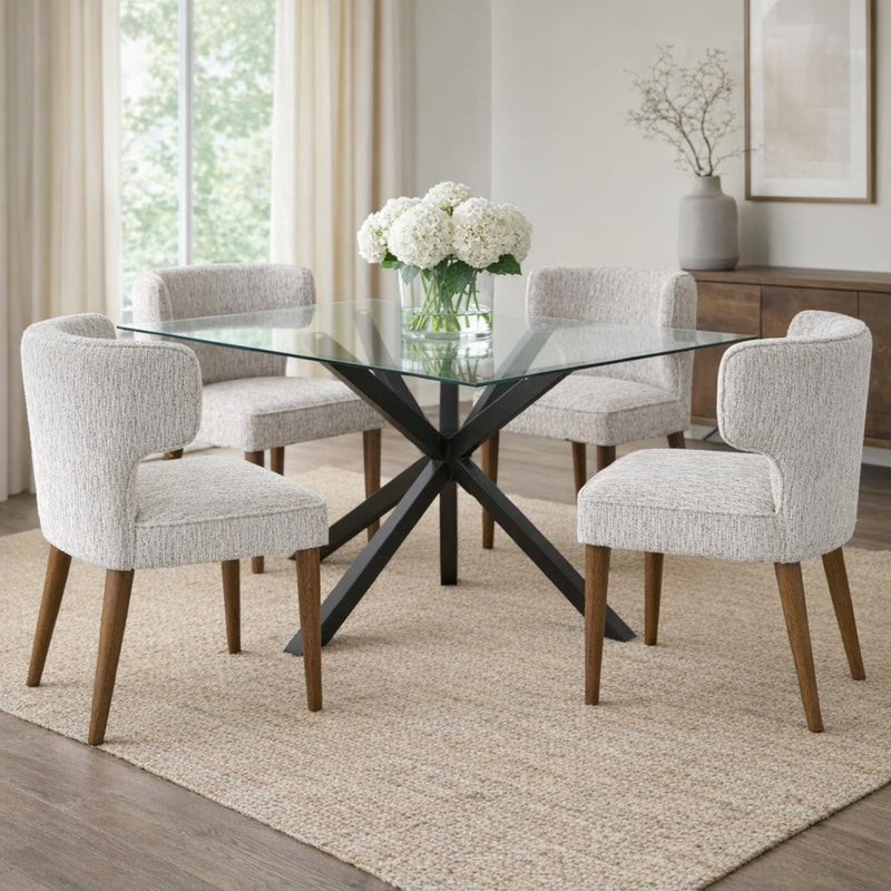 Avia mist grey chairs around a round glass dining table