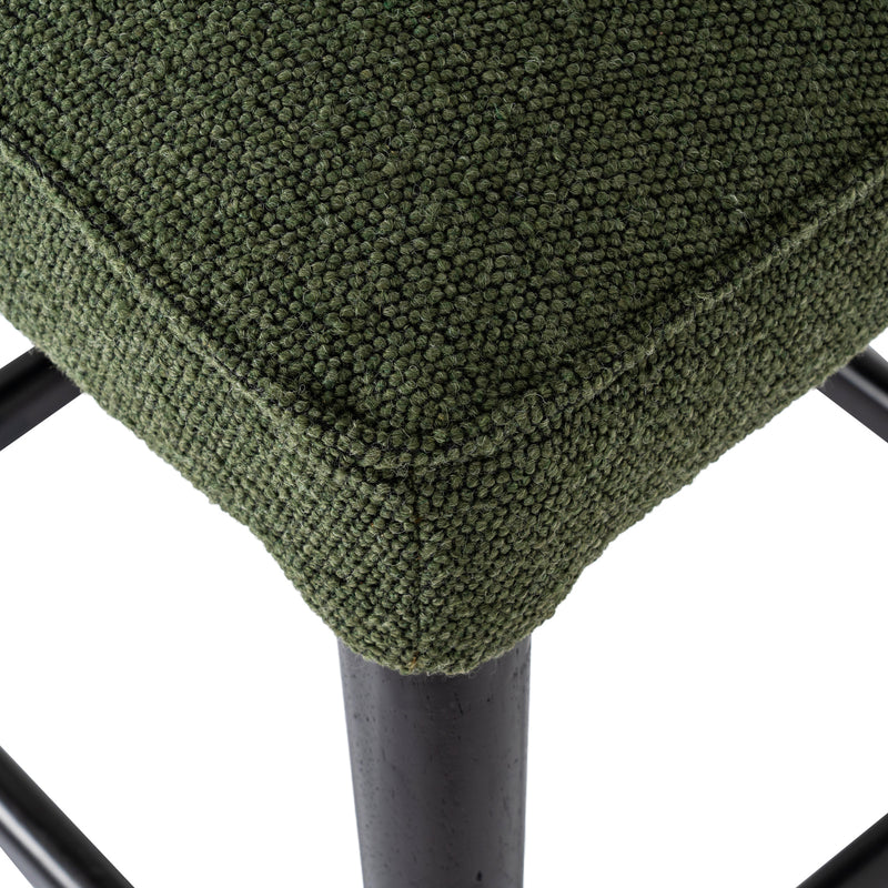 Close-up of the seat edge and black leg