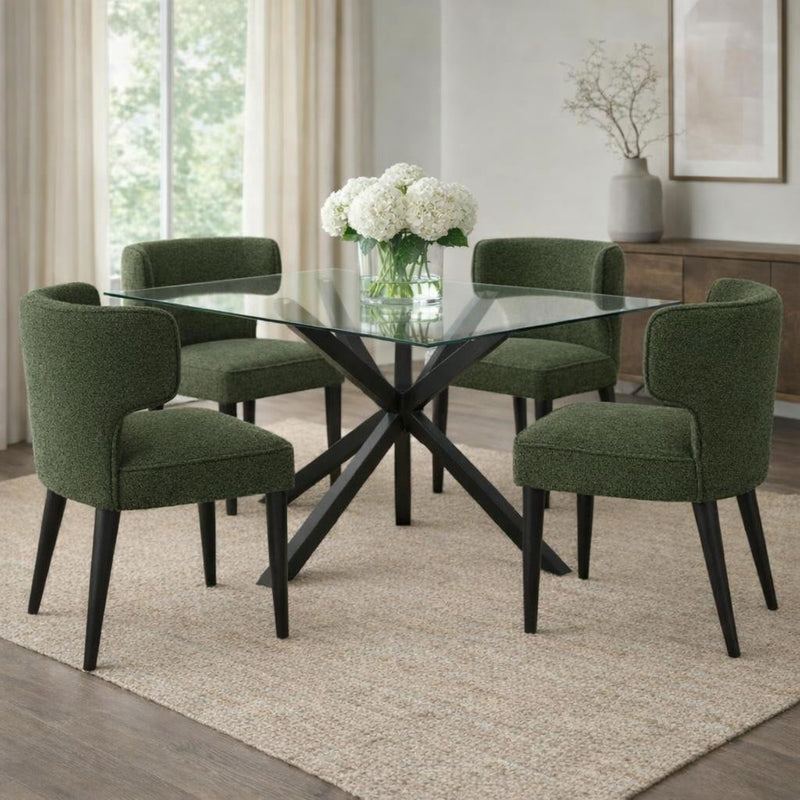 Avia moss green chairs around a round glass dining table