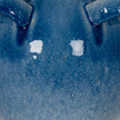 Close-up of the blue glaze fading to a paler base