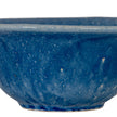 Close-up of the speckled blue glaze