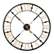 Black and gold metal skeleton wall clock with Roman numerals