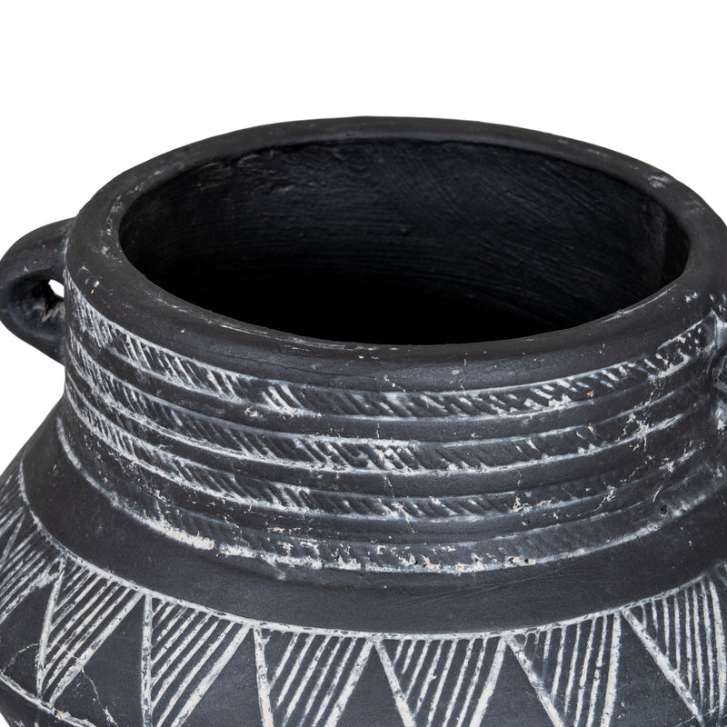Inside rim and handle of the black etched pot