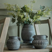 Etched pots holding greenery on a shelf, shown with other sizes sold separately