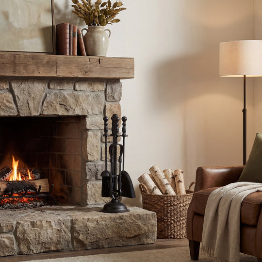Black Fireside Companion Set with Duchess Top – 41cm, companion set beside a lit stone fireplace