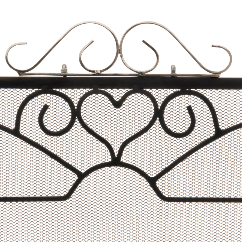 Close-up of the heart scrollwork and chrome scroll crest
