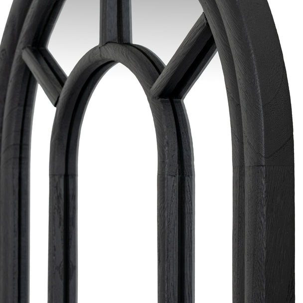 Close-up of the arched top and black wooden mullions