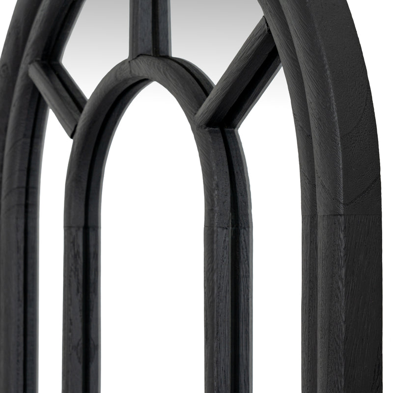Close-up of the arched top and black wooden mullions