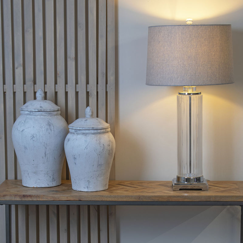 Two Bloomville ginger jars on a shelf beside a lamp, other size sold separately