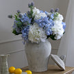 Bloomville ginger jar filled with blue and white flowers