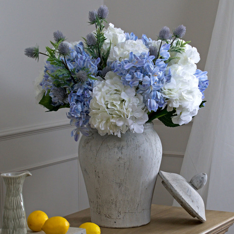 Bloomville ginger jar filled with blue and white flowers
