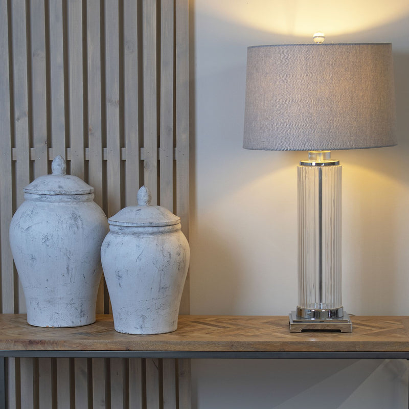 Two Bloomville ginger jars on a shelf beside a lamp, larger size sold separately