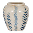 Cream ceramic vase with blue leaf pattern, front view