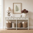 Bracken framed art above a white console table