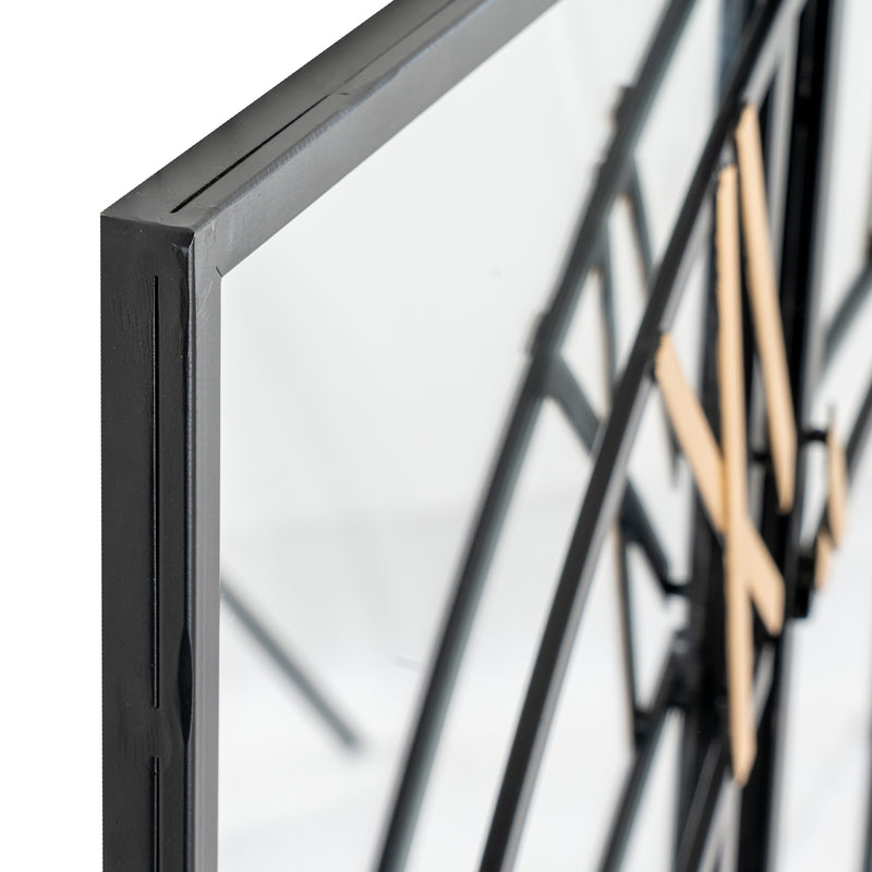 Edge of a black-framed mirrored panel