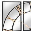 Close-up of two mirrored panels with gold Roman numerals
