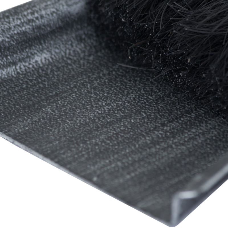 Close-up of the brushed steel shovel and black bristles