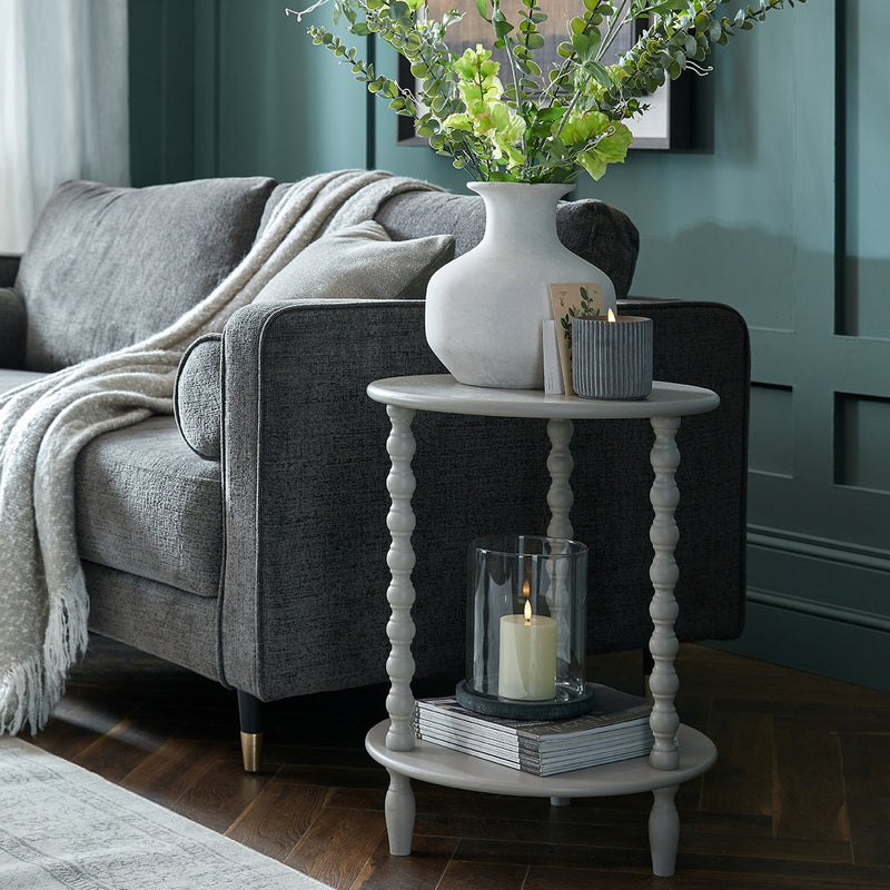 Camden round side table beside an armchair