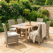Capri wicker dining chairs around a wooden garden table