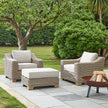 Capri footstool between two wicker armchairs in a garden, chairs sold separately