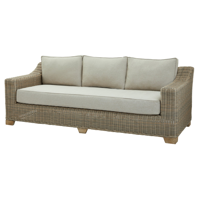 Capri wicker three-seater sofa with cream cushions