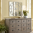 Celina mirrored wall clock above a wooden sideboard