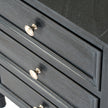 Close-up of the drawers and brass-toned knobs