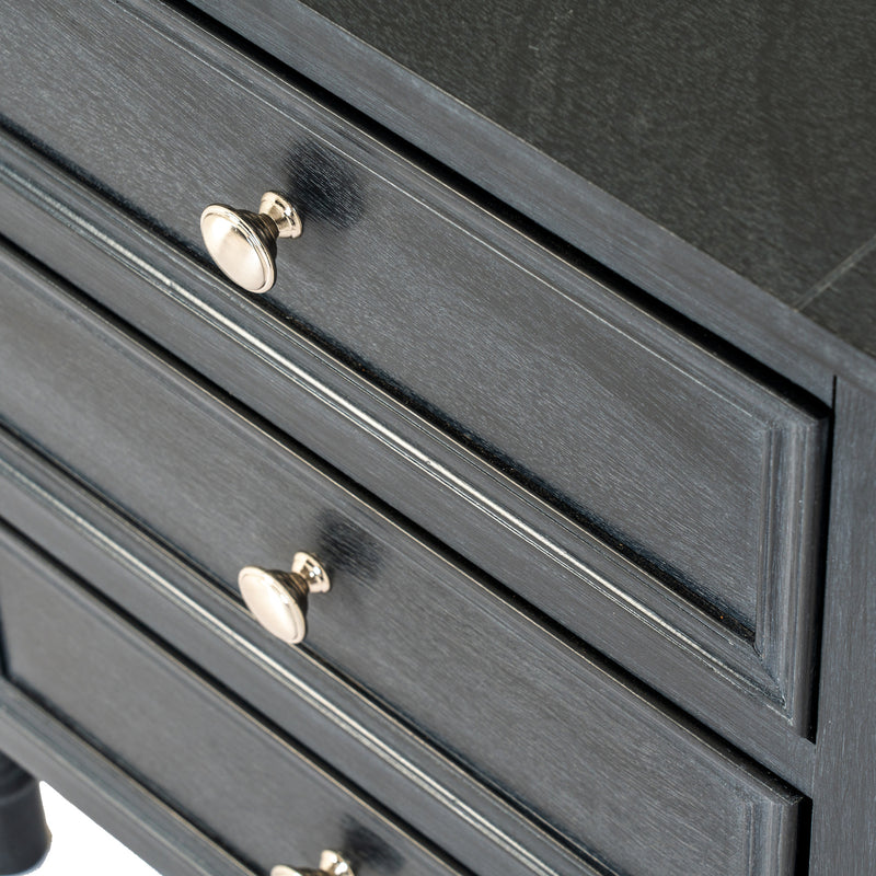 Close-up of the drawers and brass-toned knobs