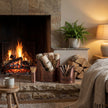 Copper Log & Kindling Bucket Set with Matchstick Holder, copper buckets beside a lit fireplace