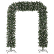 8.2ft snow-frosted Christmas tree arch with pine cones framing an indoor doorway
