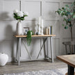 Darcy Ople vase on a hall table with flowers and candles
