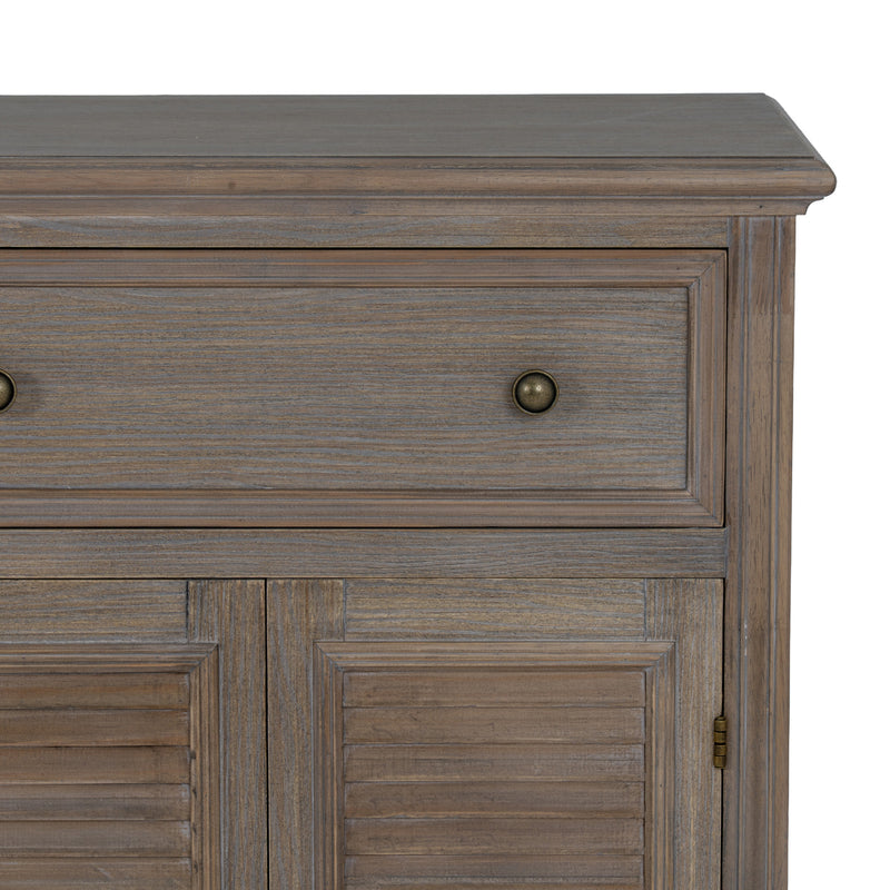 Close-up of a drawer, knob and louvred doors