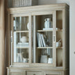 Glass dresser top with books and jugs, shown on the base sold separately