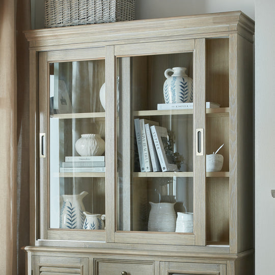 Glass dresser top with books and jugs, shown on the base sold separately