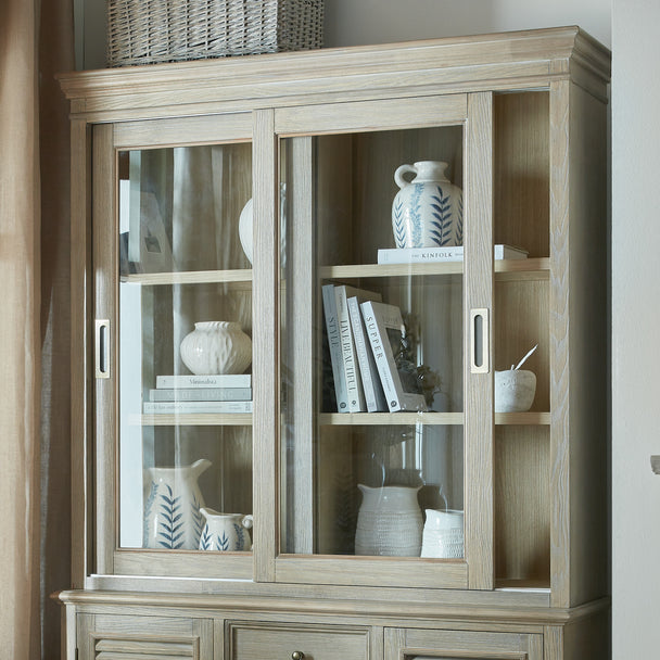 Glass dresser top with books and jugs, shown on the base sold separately