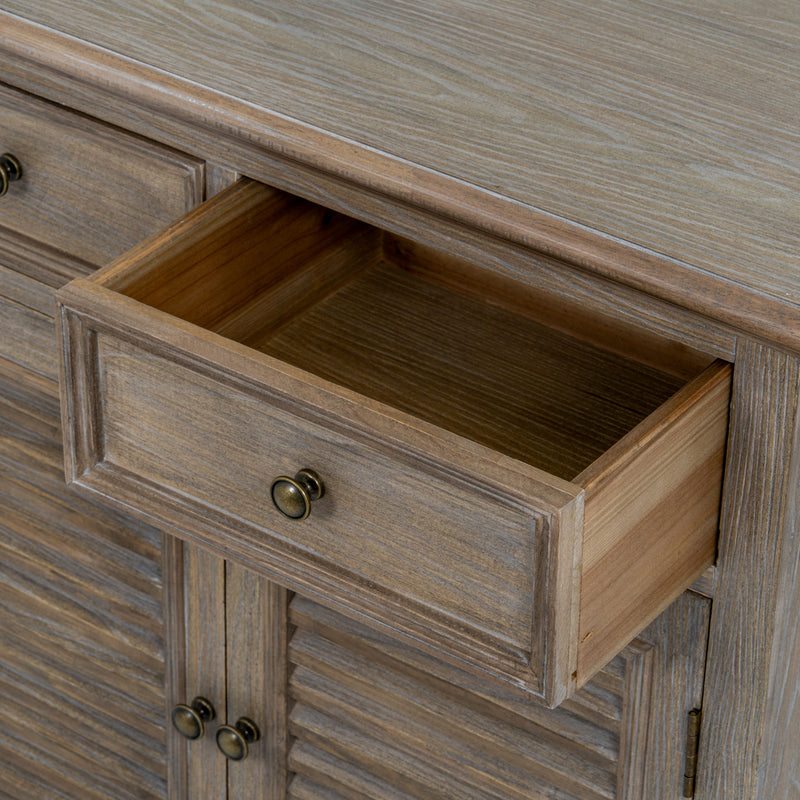 close-up of an open drawer and round metal knob