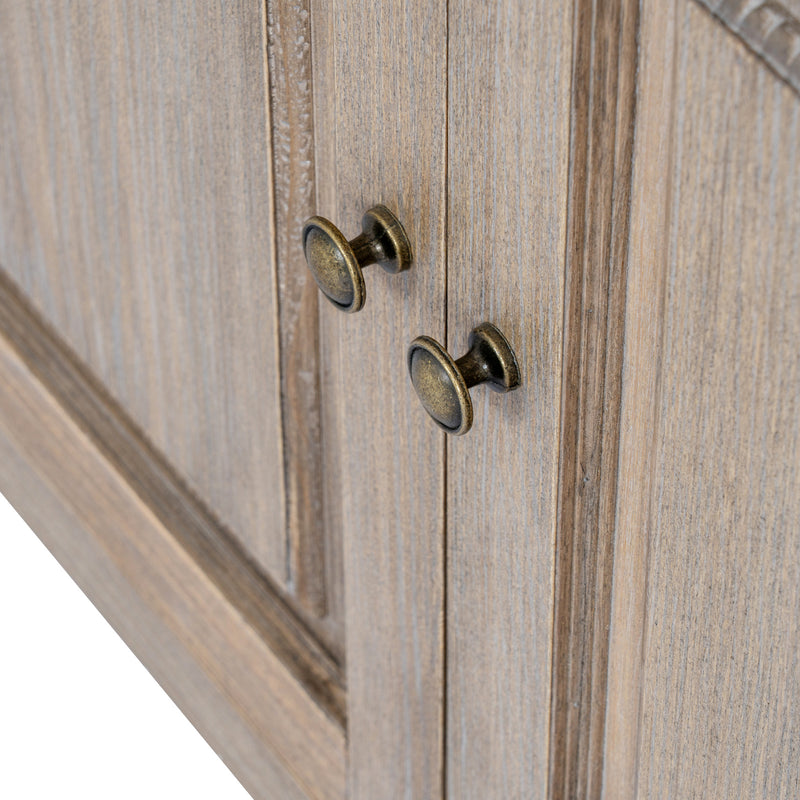 Close-up of the antique-brass knobs and weathered wood