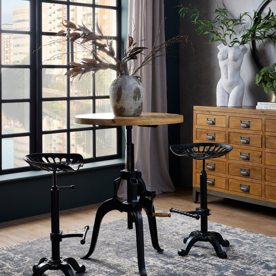 Draftsman bistro table with stools by a window, stools sold separately