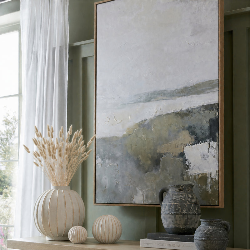 Natural bunny tails in a cream vase on a mantelpiece