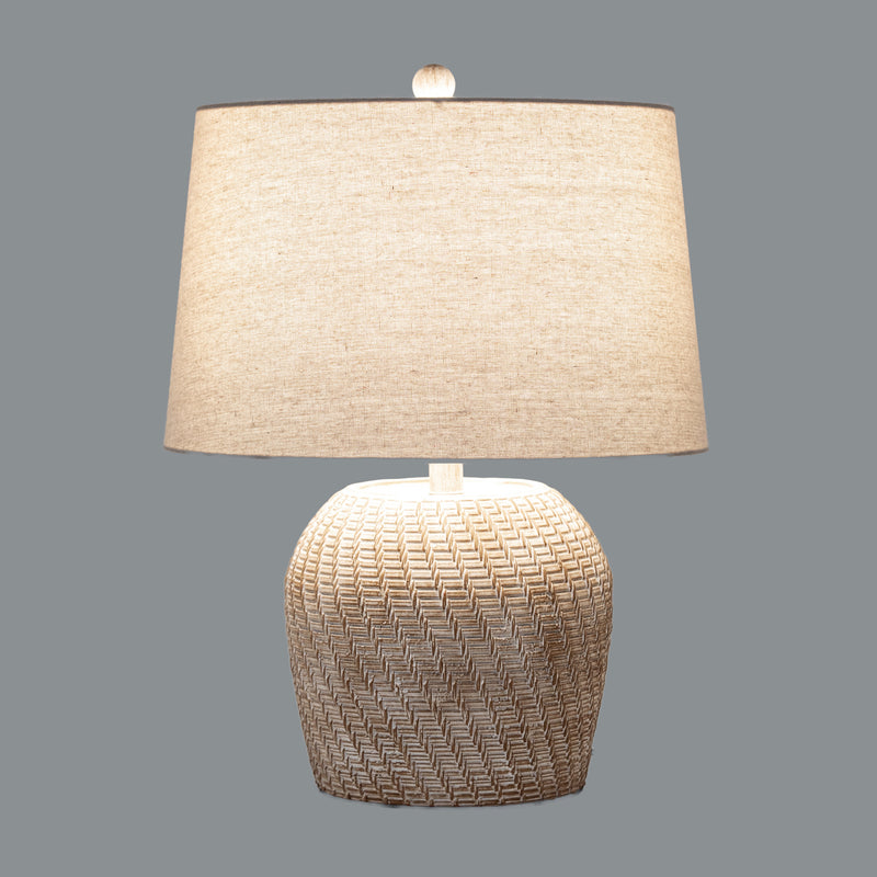 Dune table lamp switched on against a grey background