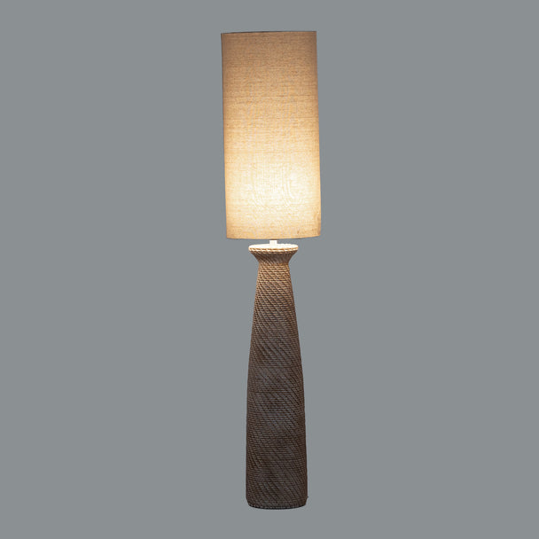 Dune floor lamp switched on against a grey background