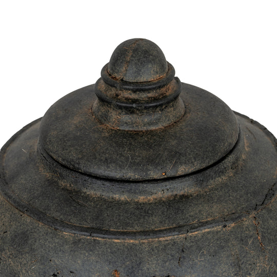 Close-up of the stepped lid and weathered glaze