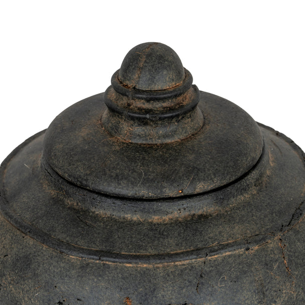 Close-up of the stepped lid and weathered glaze
